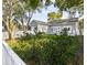 Lush green backyard with a white picket fence, perfect for outdoor activities and relaxation at 1513 Pinecrest Pl, Orlando, FL 32803