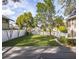 A spacious backyard deck with a lush lawn and a surrounding privacy fence at 1513 Pinecrest Pl, Orlando, FL 32803