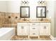 A primary bathroom featuring a double vanity, soaking tub, and granite countertop at 1513 Pinecrest Pl, Orlando, FL 32803