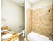 This bathroom features granite counters with double sinks, a shower over tub, and tile surround at 1513 Pinecrest Pl, Orlando, FL 32803