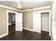 This bedroom features a ceiling fan, a closet with sliding doors, and neutral paint at 1513 Pinecrest Pl, Orlando, FL 32803