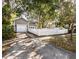 Long driveway leading to a two-car garage, enhanced by a charming white picket fence at 1513 Pinecrest Pl, Orlando, FL 32803