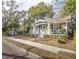 Charming single story home featuring a landscaped front yard and decorative front porch at 1513 Pinecrest Pl, Orlando, FL 32803