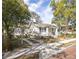 Charming single story home with a landscaped front yard and decorative front porch at 1513 Pinecrest Pl, Orlando, FL 32803