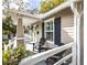 Inviting front porch with chairs, creating a cozy and welcoming entrance to the home at 1513 Pinecrest Pl, Orlando, FL 32803