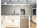 Kitchen island with stainless steel dishwasher at 1513 Pinecrest Pl, Orlando, FL 32803
