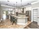 Bright kitchen features a center island, stainless steel appliances, and stylish backsplash at 1513 Pinecrest Pl, Orlando, FL 32803