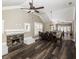 Open-concept living area with a stone fireplace, vaulted ceiling, and modern lighting fixtures at 1513 Pinecrest Pl, Orlando, FL 32803