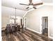 Bright open living space flowing into a dining area, featuring a fireplace and ample natural light at 1513 Pinecrest Pl, Orlando, FL 32803