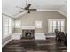 Inviting living area with hardwood floors, a fireplace, and large windows offering plenty of light at 1513 Pinecrest Pl, Orlando, FL 32803