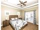 Bright primary bedroom with tray ceiling and french doors at 1513 Pinecrest Pl, Orlando, FL 32803