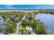 Captivating aerial view of lakeside property boasting lush surroundings, tranquil waters, and picturesque neighborhood streets at 1532 Lake Shore Dr, Orlando, FL 32803