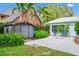 Charming backyard featuring a brick patio and lush, tropical landscaping at 1532 Lake Shore Dr, Orlando, FL 32803