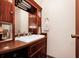 Traditional bathroom featuring wood vanity, white sink, and classic fixtures with a touch of vintage charm at 1532 Lake Shore Dr, Orlando, FL 32803