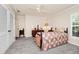 Cozy bedroom featuring a ceiling fan, neutral walls, and plush carpet flooring create a relaxing atmosphere at 1532 Lake Shore Dr, Orlando, FL 32803
