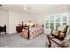 Comfortable bedroom with large windows, neutral walls, plush carpet, and stylish furnishings create a relaxing retreat at 1532 Lake Shore Dr, Orlando, FL 32803