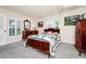 Spacious bedroom featuring carpet, ceiling fan, natural light, vintage furniture and neutral paint color at 1532 Lake Shore Dr, Orlando, FL 32803