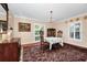 A dining room with traditional furnishings and a chandelier at 1532 Lake Shore Dr, Orlando, FL 32803