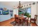 A dining room with decorative plates and a chandelier at 1532 Lake Shore Dr, Orlando, FL 32803
