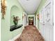 Traditional hallway with carpet, decorative wall accents, and classic trim at 1532 Lake Shore Dr, Orlando, FL 32803