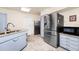 Kitchen featuring stainless steel appliances, granite counters, and ample cabinet space at 1532 Lake Shore Dr, Orlando, FL 32803