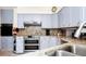 Bright kitchen with granite counters and stainless steel appliances at 1532 Lake Shore Dr, Orlando, FL 32803