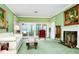 Bright living room with fireplace, large windows, and a view of the outdoors at 1532 Lake Shore Dr, Orlando, FL 32803