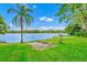 Picturesque waterfront property featuring lush greenery and serene lake views at 1532 Lake Shore Dr, Orlando, FL 32803