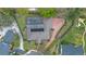 Overhead view of home with a screened pool, brick driveway, and pristine landscaping at 1600 Barcelona Way, Winter Park, FL 32789