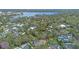 Picturesque aerial view of homes near a scenic lake surrounded by lush trees at 1600 Barcelona Way, Winter Park, FL 32789