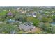 Impressive aerial view of a lovely home featuring a screened pool and landscaped grounds at 1600 Barcelona Way, Winter Park, FL 32789