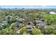 Aerial view of the neighborhood with mature landscaping showing downtown in the background at 1600 Barcelona Way, Winter Park, FL 32789
