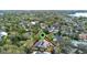 Scenic aerial shot of a neighborhood filled with mature trees, lush landscaping, and picturesque views at 1600 Barcelona Way, Winter Park, FL 32789