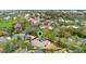 Aerial view of property surrounded by mature trees and landscaped grounds with property lines at 1600 Barcelona Way, Winter Park, FL 32789