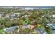 An aerial view shows the home surrounded by mature trees with defined property lines at 1600 Barcelona Way, Winter Park, FL 32789