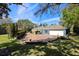 Exterior view of a charming home with lush landscaping at 1600 Barcelona Way, Winter Park, FL 32789