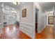 Elegant foyer with hardwood floors, decorative molding, and ample natural light creating a welcoming entrance at 1600 Barcelona Way, Winter Park, FL 32789