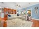 Comfortable living room featuring built-in shelving, plenty of light, and hardwood floors offering cozy atmosphere at 1600 Barcelona Way, Winter Park, FL 32789