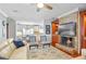 Inviting living area boasts fireplace, hardwood flooring, and open flow to the modern kitchen offering seamless living at 1600 Barcelona Way, Winter Park, FL 32789