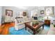 Charming living room features hardwood floors, comfortable seating, and large windows, perfect for entertaining at 1600 Barcelona Way, Winter Park, FL 32789