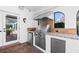 Outdoor kitchen with stainless steel grill, granite countertops, mini fridge, and brick flooring at 1600 Barcelona Way, Winter Park, FL 32789