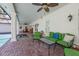 Spacious covered patio with outdoor seating, a plunge pool, and views of the landscaped backyard at 1600 Barcelona Way, Winter Park, FL 32789