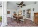Covered outdoor patio with a large wooden table and seating, perfect for dining and entertaining at 1600 Barcelona Way, Winter Park, FL 32789