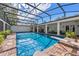 Spacious pool with screened enclosure and plenty of room for entertaining and relaxation at 1600 Barcelona Way, Winter Park, FL 32789