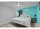 Bedroom featuring a white bed and an accent wall at 19624 E Umatilla Blvd, Umatilla, FL 32784