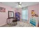 Bright bedroom with wood look flooring and a ceiling fan at 19624 E Umatilla Blvd, Umatilla, FL 32784