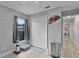 Bedroom featuring an electric fan, a litter box, and laminate flooring at 19624 E Umatilla Blvd, Umatilla, FL 32784