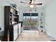 Dining area with bar, cabinets and view of the backyard through sliding glass doors at 19624 E Umatilla Blvd, Umatilla, FL 32784
