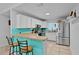 Eat in kitchen features white cabinets and stainless steel appliances at 19624 E Umatilla Blvd, Umatilla, FL 32784