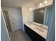 Bathroom featuring double sinks, quartz counters, and tile flooring at 1995 Iorio St, St Cloud, FL 34771